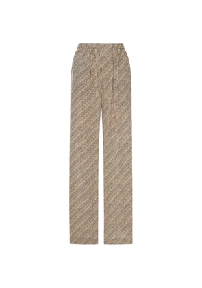 Balenciaga all-over logo-print silk trousers - Neutrals