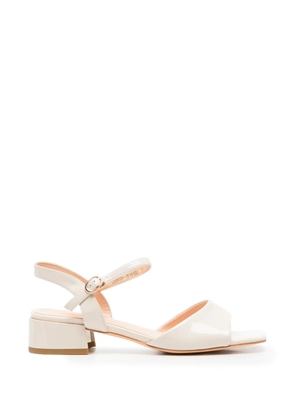LINDA BAUMANN patent-finish buckle-fastening sandals - Neutrals