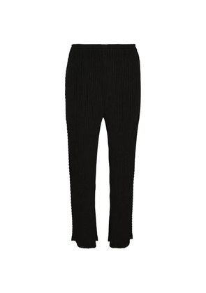 Issey Miyake plissé-effect trousers - Black