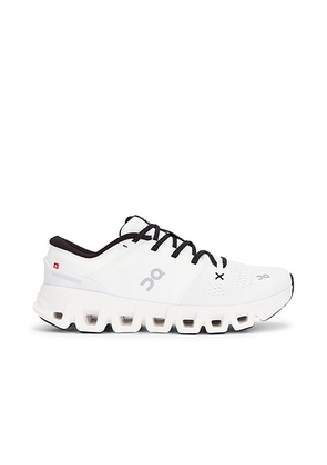 On Cloud X 5 in White & Black - White. Size 11 (also in 7, 7.5, 8, 8.5, 9, 9.5, 10, 10.5, 11.5, 12, 13, 14).