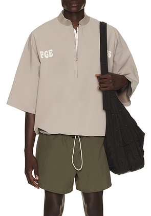 Fear of God ESSENTIALS Half Zip Baseball Shirt in Seal - Grey. Size XL/1X (also in XS, S, M, L, XXL/2X, XXXL/3X).
