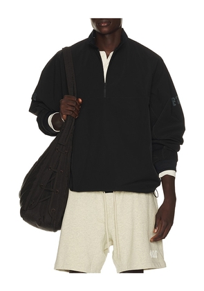 Fear of God ESSENTIALS Half Zip Track Jacket in Black. Size XS. Also in S, M, L, XL/1X, XXL/2X, XXXL/3X.