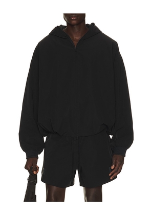 Fear of God ESSENTIALS Full Zip Hooded Anorak in Black. Size XS. Also in S, M, L, XL/1X, XXL/2X, XXXL/3X.