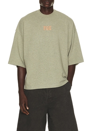 Fear of God ESSENTIALS Merch Tee in Washed Seal Heather - Grey. Size M (also in XS, S, L, XL/1X, XXL/2X, XXXL/3X).