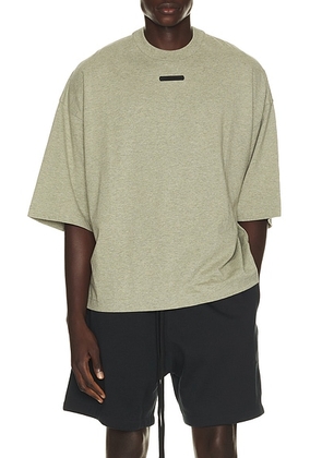 Fear of God ESSENTIALS Merch Tee in Seal Heather - Green. Size XS (also in S, M, L, XL/1X, XXL/2X, XXXL/3X).