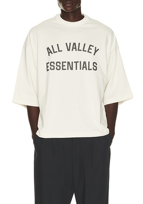 Fear of God ESSENTIALS Merch Tee in Ivory - White. Size XL/1X (also in XS, S, M, L, XXXL/3X).