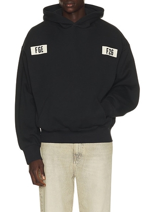 Fear of God ESSENTIALS 90's Hoodie in Vintage Black - Black. Size XL/1X (also in XS, S, M, L, XXL/2X, XXXL/3X).