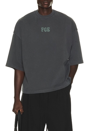 Fear of God ESSENTIALS Merch Tee in Washed Iron Grey - Grey. Size S (also in XS, M, L, XL/1X, XXL/2X, XXXL/3X).