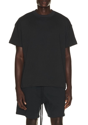 Fear of God ESSENTIALS Tee in Vintage Black - Black. Size XS (also in S, M, XL/1X, XXL/2X).