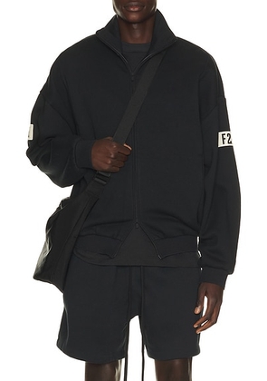 Fear of God ESSENTIALS Track Jacket in Vintage Black - Black. Size XL/1X (also in XS, S, M, L, XXL/2X, XXXL/3X).