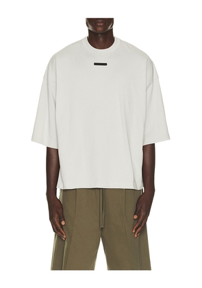 Fear of God ESSENTIALS Merch Tee in Grey. Size XS. Also in S, M, L, XL/1X, XXL/2X, XXXL/3X.