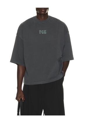 Fear of God ESSENTIALS Merch Tee in Grey. Size XS. Also in S, M, L, XL/1X, XXL/2X, XXXL/3X.