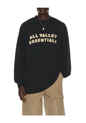 Fear of God ESSENTIALS Merch Long Sleeve Tee in Black. Size XS. Also in S, M, L, XL/1X, XXL/2X, XXXL/3X.