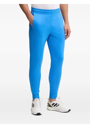 Under Armour logo-detail track pants - Blue