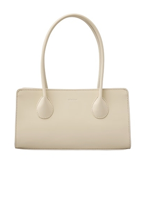 Lie Studio The Lou Bag in Creme Patent Leather - Cream. Size all.