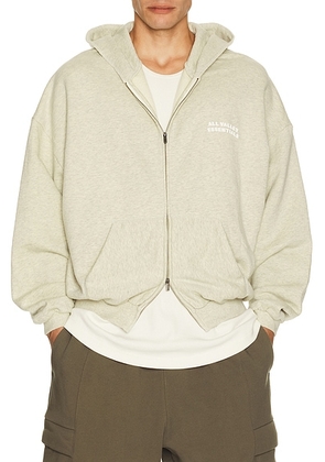Fear of God ESSENTIALS 90's Zip-Up Hoodie in Washed Vanilla Heather - Cream. Size XS (also in S, M, L, XL/1X, XXL/2X, XXXL/3X).