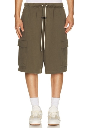 Fear of God ESSENTIALS Cargo Basketball Short in Moss - Green. Size XXXL/3X (also in XS, S, M, L, XL/1X, XXL/2X).