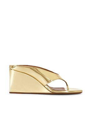 ALAÏA Wedge Thong Mule in Platine - Metallic Gold. Size 37 (also in 36, 38, 40).