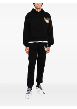 Melt graphic-print track pants - Black