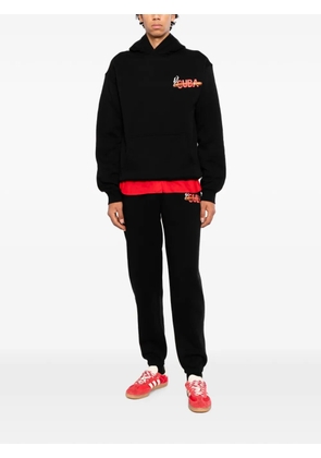 Melt graphic-print track pants - Black