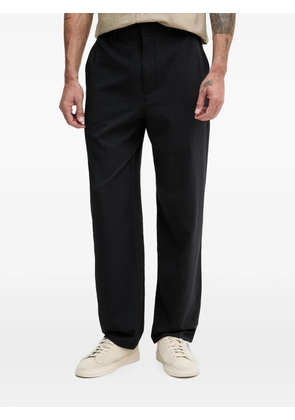 Armani Exchange seersucker-textured logo-plaque trousers - Blue