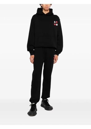 Melt graphic-print track pants - Black