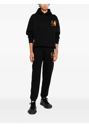 Melt graphic-print track pants - Black