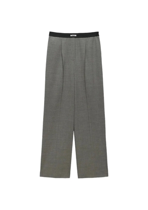 MSGM logo-waistband pleated trousers - Grey