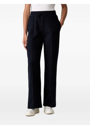 GUESS USA monogram-pattern drawstring track pants - Blue