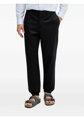 Armani Exchange monogram-pattern elasticated-cuff trousers - Blue