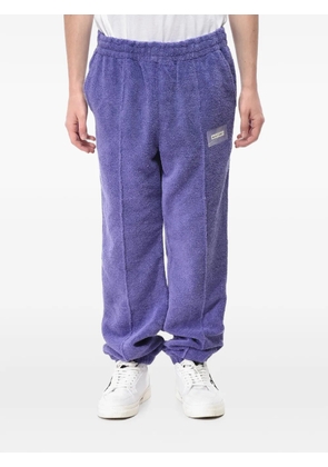 Off-White logo-patch terry-cloth track pants - Purple