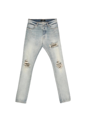 AMIRI stud-embellished distressed jeans - Blue