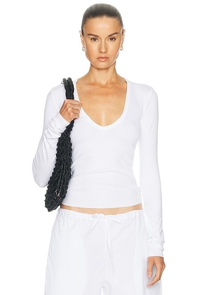 Eterne Long Sleeve Butter Rib V Neck Top in White - White. Size XS (also in S, M, L).