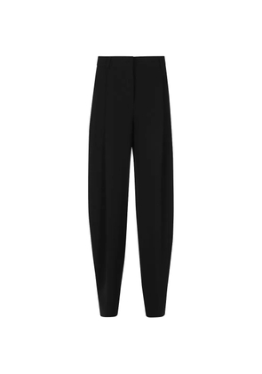 THE ANDAMANE pleated tapered trousers - Black