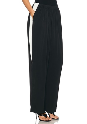 ALAÏA Straight Pant in Noir Alaia - Black. Size 40 (also in 34, 36).