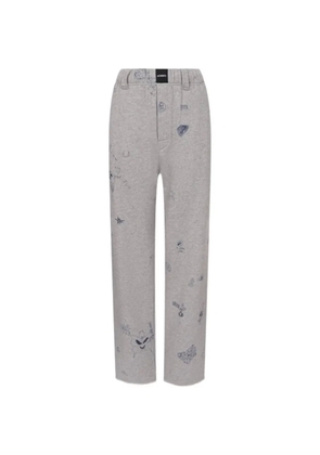 VETEMENTS scribble-print trousers - Grey