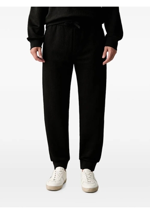 Armani Exchange logo-jacquard drawstring track pants - Black