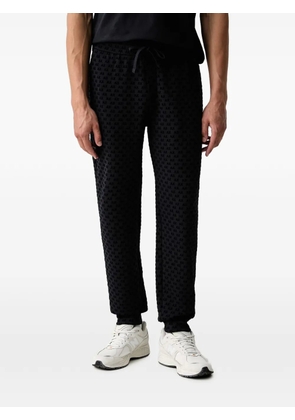 Armani Exchange logo-pattern track pants - Black