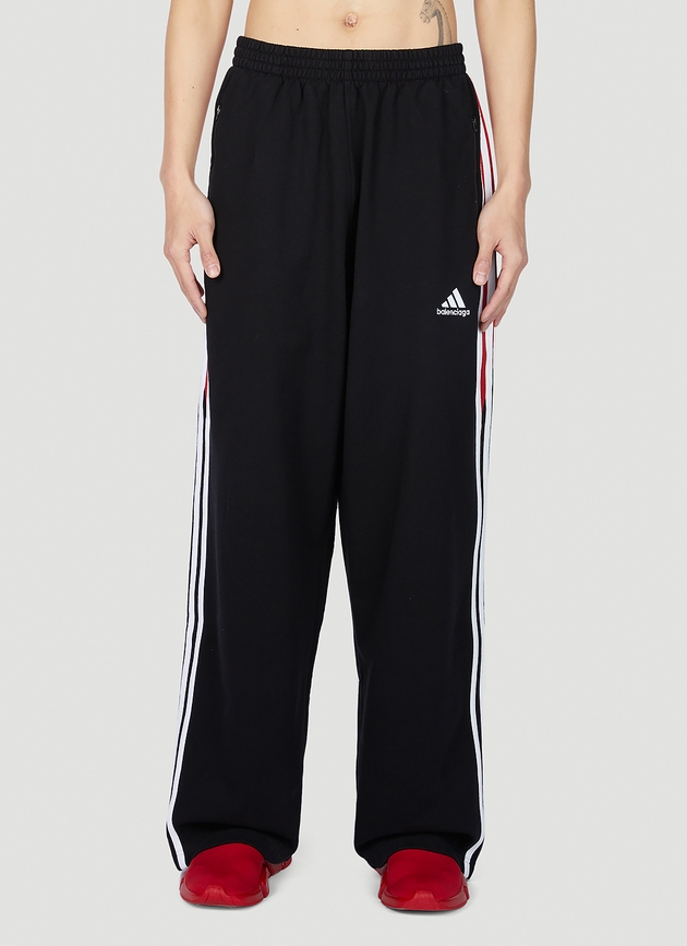 https://cdn-images.milanstyle.com/fit-in/630x900/filters:quality(100)/spree/images/attachments/010/901/638/original/balenciaga-x-adidas-baggy-track-pants-man-pants-red-xs-ln-cc-photo.jpg