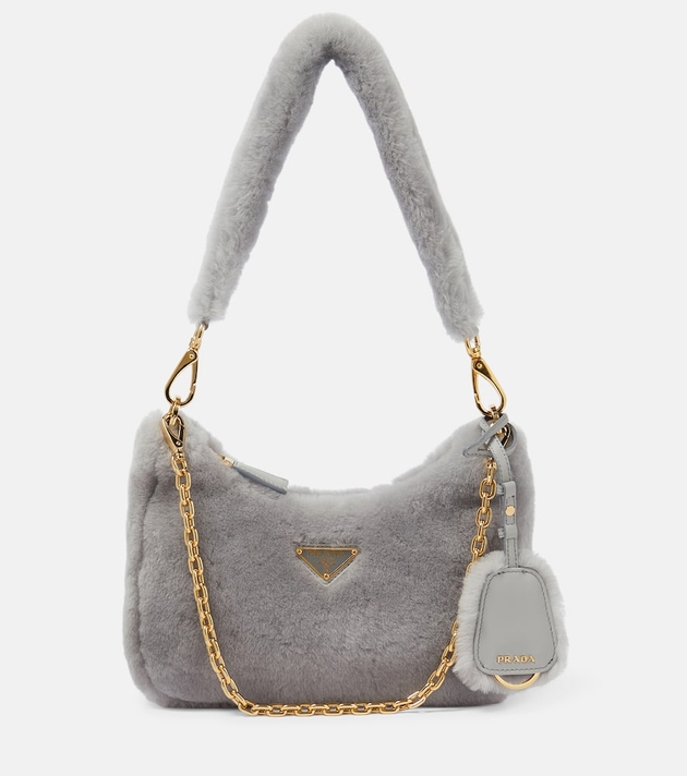 https://cdn-images.milanstyle.com/fit-in/630x900/filters:quality(100)/spree/images/attachments/016/710/305/original/prada-re-edition-2005-shearling-shoulder-bag-mytheresa-photo.jpg